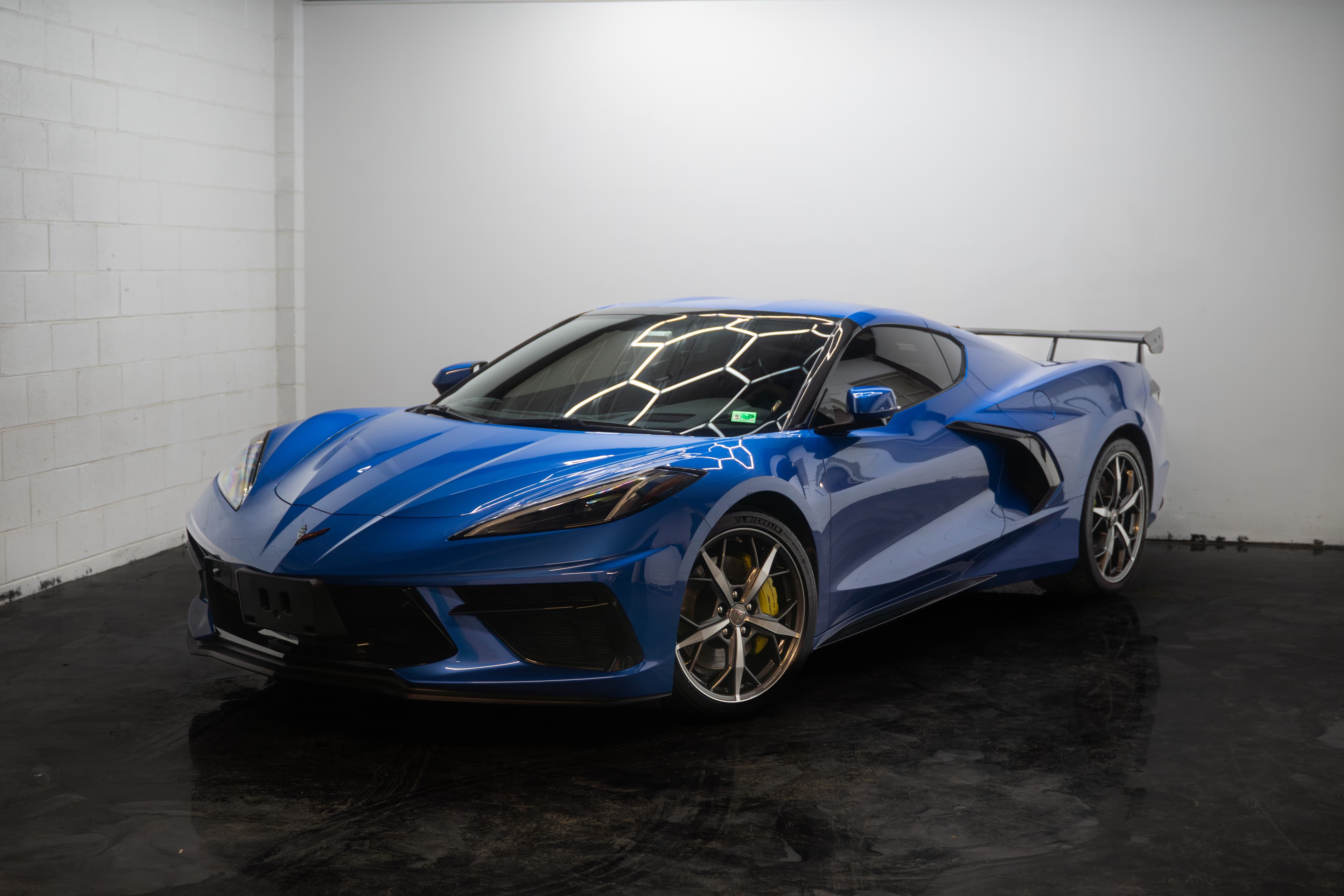 Flawless Corvette with ceramic coating gleaming under light